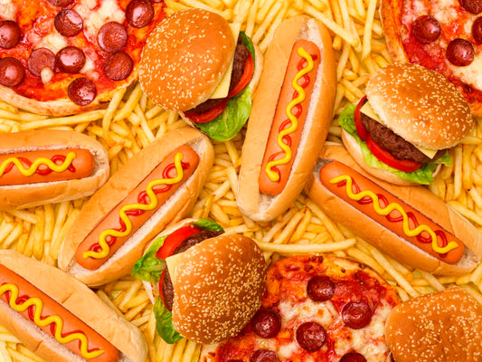 Image of junk and process foods such as pizza, hotdogs and burgers